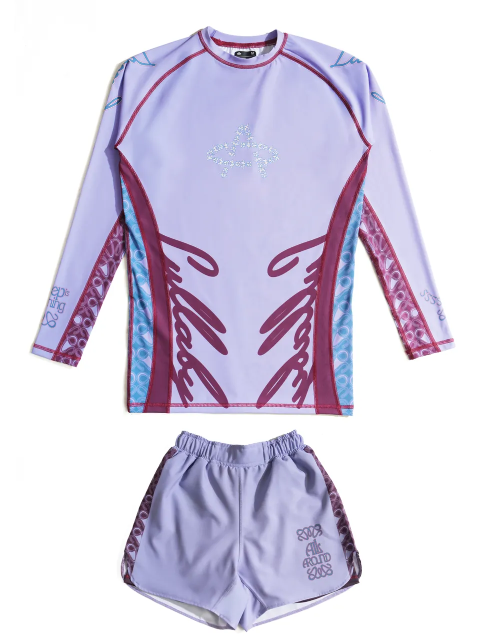 A rashguard and matching shorts, laid out as a set.